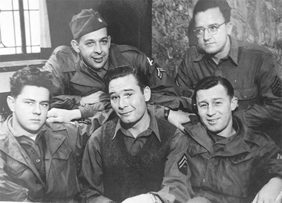Photograph showing NCOs and Enlisted Men of the 11th Evac Hosp.  First row, left to right: Cpl. Milo S. Moe, T/5 Gene Mayer, T/Sgt R. V. Krause. Back Row, left to right: Cpl. Jerome J.Lawrence and Sgt. Russell Jenning.