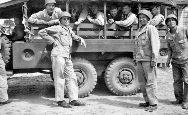 Personnel of the 48th Field Hospital in training. The vehicle illustrated is a 1 1/2-Ton , 6 X 6, Truck, Cargo & Personnel Carrier, manufactured by the Dodge Brothers Corporation (a Division of Chrysler Corporation). 