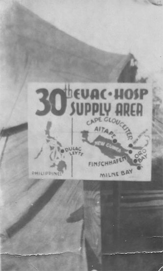30th Evacuation Hospital Supply Area signpost. Photograph taken during the unit's time in the Philippines. 