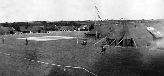 Partial view of 107th Evacuation Hospital bivouac. Photo of tentage probably taken somewhere in the field during the No. 8 Tennessee Maneuvers.