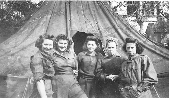 Group of Nurses in front of a M-1934 Fire-Resistant Pyramidal Tent. Maximum capacity of such a tent was 8 people when the pot-bellied stove was not in use. However for reasons of comfort and sanitation, it was recommended to limit the number of persons to 6 when supply of tentage was sufficient.
