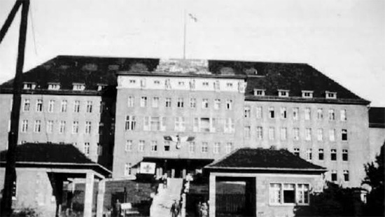 Picture illustrating the former German hospital buildings in Würzburg, Germany, now occupoied by the 107th Evacuation Hospital starting 21 May 1945.