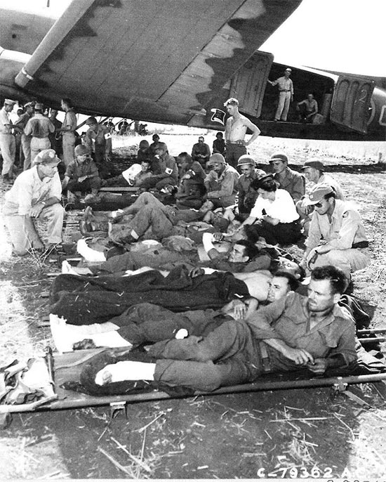 Vintage photo illustrating Allied litter patients waiting to board an evacuation plane that will take them to North Africa. Photo taken at the Agrigento airfield, Sicily, 25 July 1943. The first air evacuation flights left on 23 July. As the campaign moved, additional flights were organized departing from Castelvetrano, Palermo, and Termini.