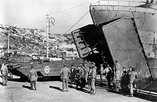 Vintage photo illustrating DUKWs (2 1/2-ton amphibious trucks) leaving an  LST. Photo taken at the Port of Naples, Italy, July 1944.