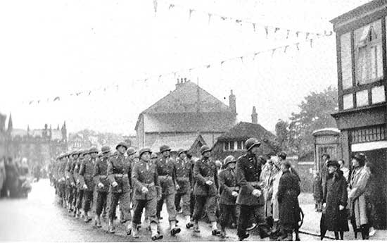 Personnel of the 34th Evacuation Hospital parading during the “Salute the Soldier Week” in Cheshire County, England.
