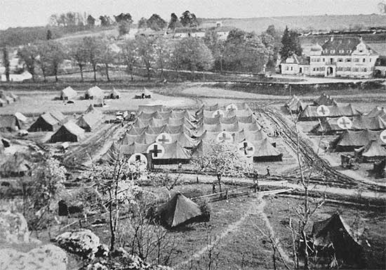 Partial aerial view of the 34th Evacuation Hospital installations (under tentage) at Sandersdorf, Germany. This was to become the unit’s last setup until the end of the war and the organization’s last stay in the European Theater. The unit remained at Sandersdorf from 28 April to 12 May 1945, where it celebrated V-E Day as well as Memorial Day services.