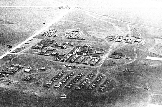 End May 1945, aerial view taken from a liaison aircraft of the 56th Evacuation setup at Udine, north of Trieste, Italy, where the organization would receive its very last patient. The 16th Evacuation Hospital relieved the 56th at Udine on August 4, 1945. 