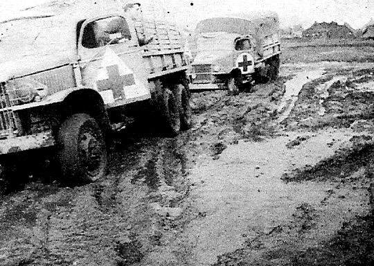 November 1943, trucks of the 56th Evacuation Hospital stuck in the mud in the area around Dragoni, Italy.