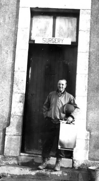 Picture illustrating Major Thomas G. Ferguson, Surgical Division, in front of the building housing Surgery. Picture probably taken at Commercy, France, October 1944.