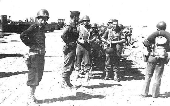 Picture illustrating personnel of the 56th Evacuation Hospital having just landed at Paestum, Italy, September 26, 1943.