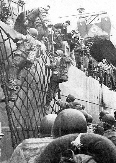 April 9, 1944, Enlisted personnel of the 56th Evacuation Hospital transfer to an offshore LST from an LCT which they initially boarded at Anzio harbor.