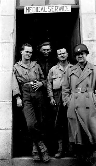 Picture showing Captain John J. Stubbs and some of his Medical Division crew in France. Picture probably taken while stationed in Commercy, France, October 1944.