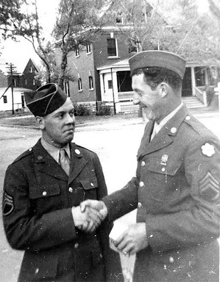 Photograph illustrating Staff Sergeants Eugene Gimbel and Albert Pauly at Fort Francis E. Warren, Cheyenne, Wyoming. Photo taken prior to the unit’s oversea movement, end 1943, early 1944.